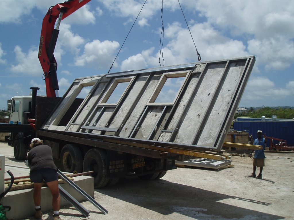 precast housing panels made with foamed concrete to provide light weight thermally insulating walls