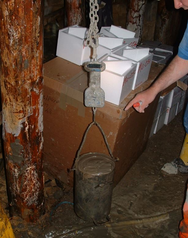 10 litres calibrated density pots are used to sample the material density, this pot is then used to  produce a set of 3 cube mould on site  to be crushed at a later date