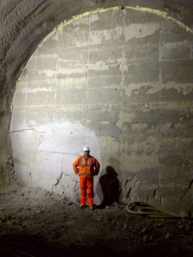 Foamed Concrete tunnels, here at stepney green, London, Our director stands in-front of a filled tunnel, this is the final material that the TBM will be breaking through before being dismantled