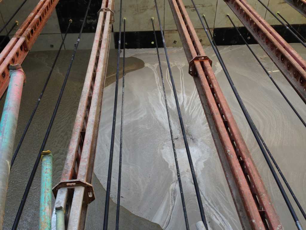 Foam concrete flowing over cured material poured in the previous 24 hours, the foam concrete is designed to hit no more than 1 Newton within 28 days